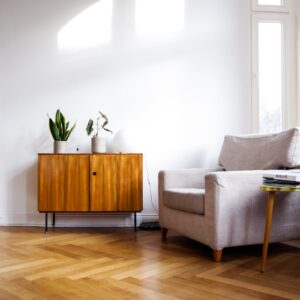 brown wooden table beside gray couch