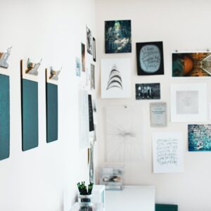 three green clipboards on wall